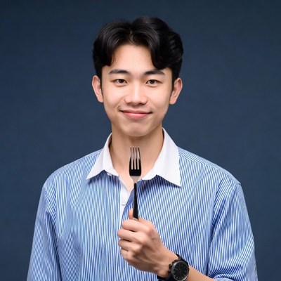 Asian man holding fork