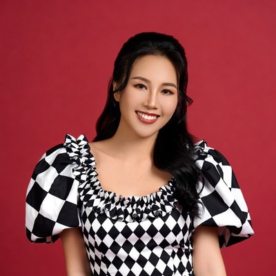 Asian woman in black white checkered dress