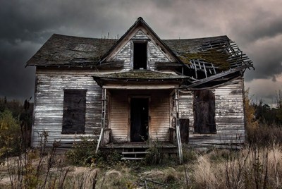 Abandoned Victorian House in Stormy Field