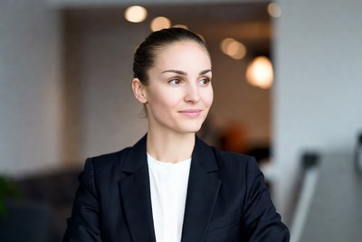 Woman in black blazer smiling