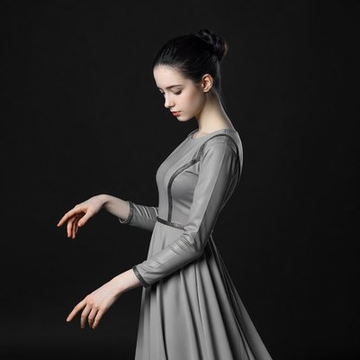 Woman dancing in gray dress