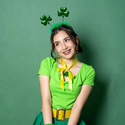 Asian woman in St. Patrick's Day shamrock headband