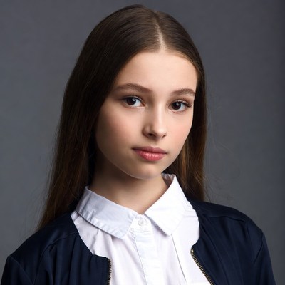 Teen girl in white shirt and navy blazer