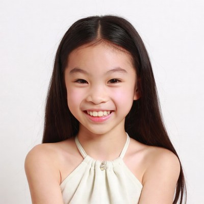 Smiling Asian girl in white dress