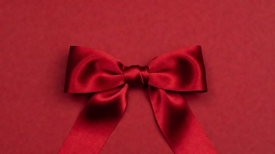 Red Satin Bow on Red Background