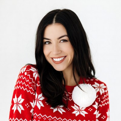 Smiling woman in red Christmas sweater