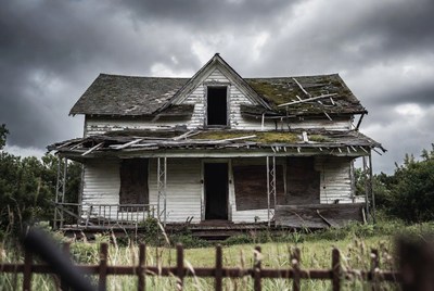 Abandoned White House in Stormy Weather