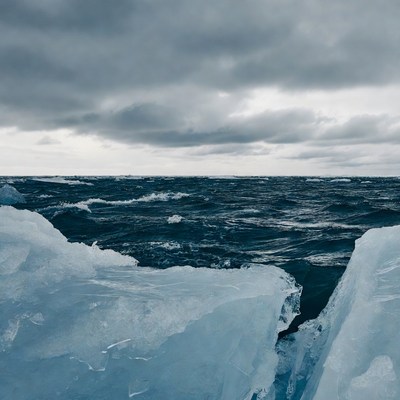 Icebergs in Stormy Ocean Waves