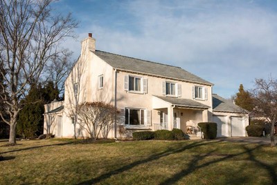 Beige Colonial House with Garage