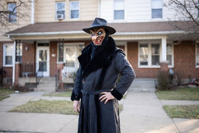 Man in demon mask and trench coat
