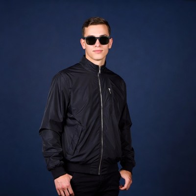 Young man in sunglasses and black jacket