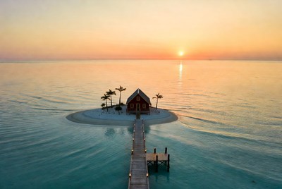 Red House on Tiny Island at Sunset
