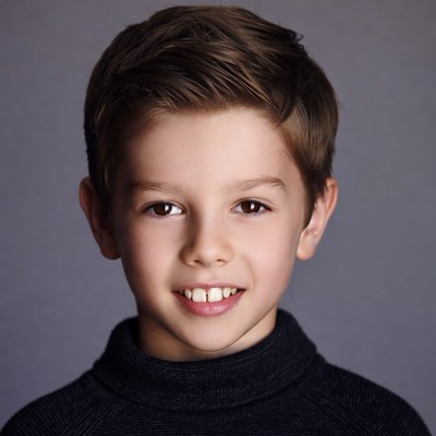 Smiling boy in black turtleneck