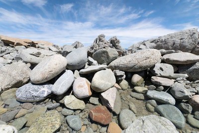Large pile of colorful rocks beach