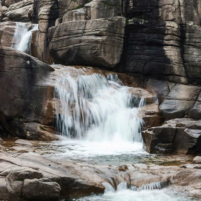 Waterfall cascading over rocky cliffs