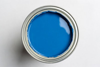 Open can of blue paint
