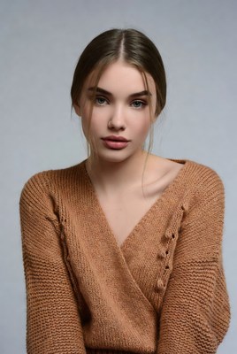 Young woman in rust sweater