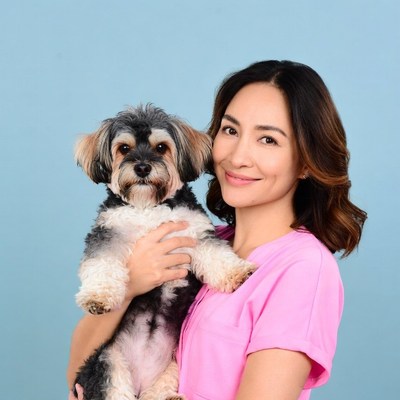 Asian woman holding Yorkshire Terrier