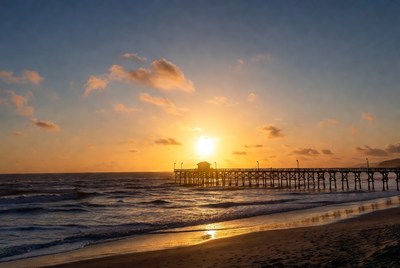 Sunrise over pier and ocean