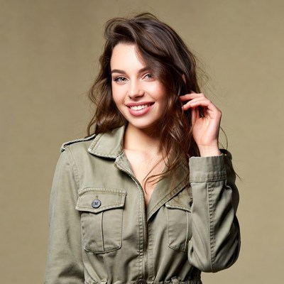 Smiling woman in green jacket