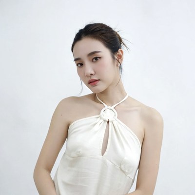 Asian woman in white halter top