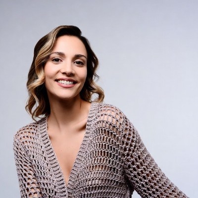 Smiling woman in knitted sweater