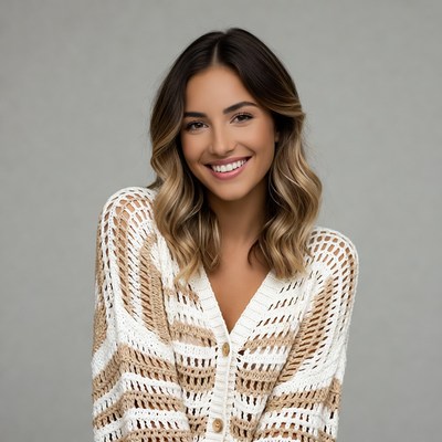 Smiling woman in crochet sweater