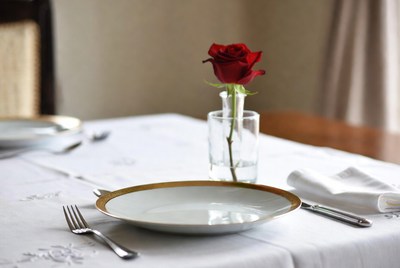 Red Rose in Glass Vase on Dinner Table