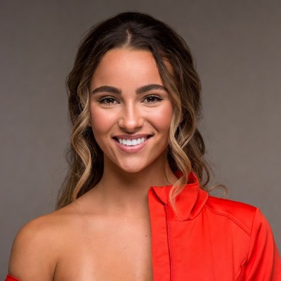 Smiling woman in red off-shoulder top