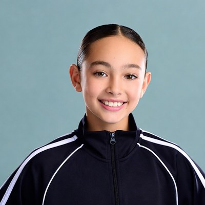 Smiling Asian girl in black tracksuit