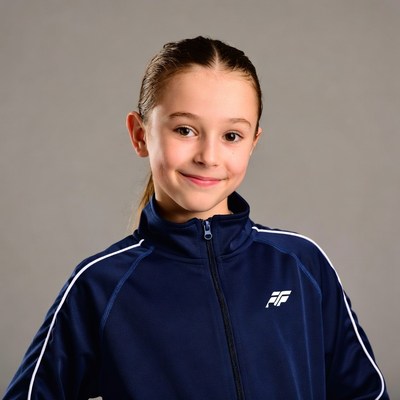Smiling girl in navy tracksuit
