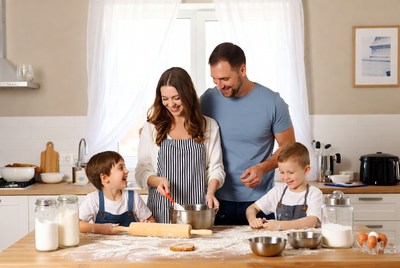 Family baking cookies in kitchen
