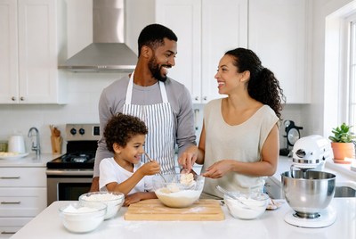 African-American family baking in kitchen