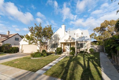White Suburban House with Landscaping