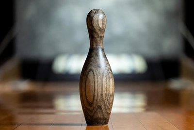 Wooden bowling pin on lane