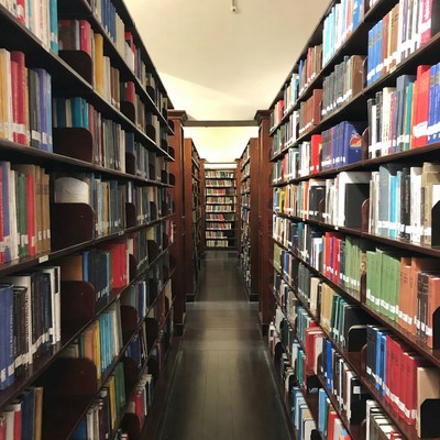 Long library aisle with bookshelves