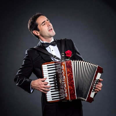 Man playing accordion in tuxedo