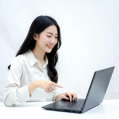 Asian woman using laptop