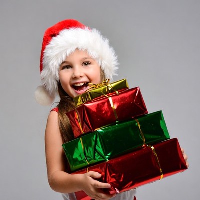 Girl holding Christmas presents