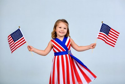 Girl holding American flags