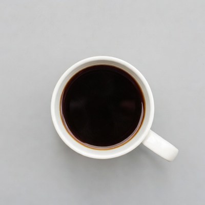 Top view of coffee in white cup