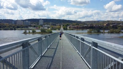 Person walking on pedestrian bridge