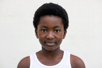 African boy in white tank top