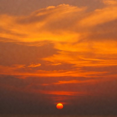 Vibrant orange sunset over horizon