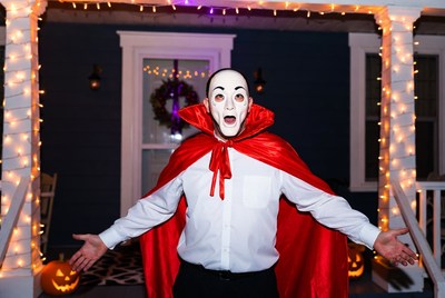 Man in vampire costume on porch