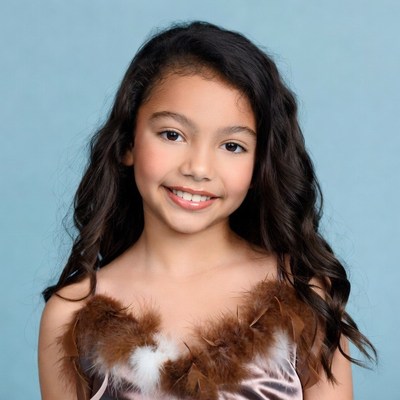 Smiling girl in feathered dress