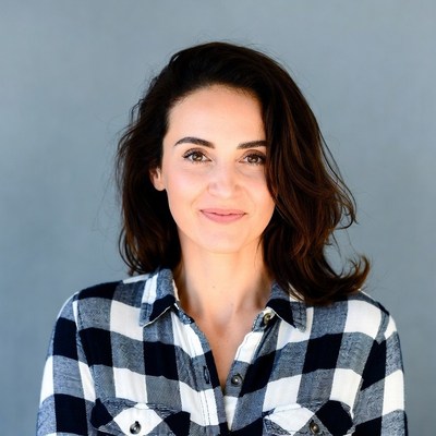 Woman in plaid shirt smiling