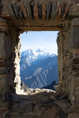 Snowy Mountains Through Stone Window