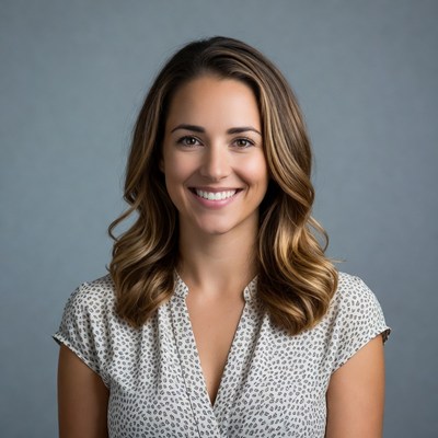Smiling woman with wavy brown hair