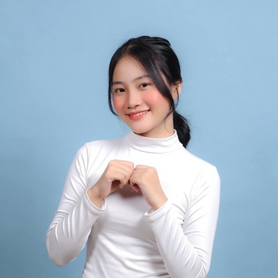 Asian girl making heart hands